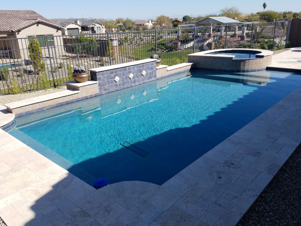 Backyard swimming pool and decking built by Saturn Pool Company in Arizona